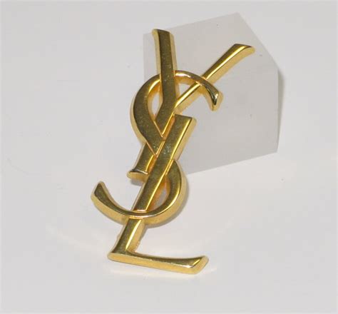 pin's yves saint laurent|Saint Laurent brooch pins.